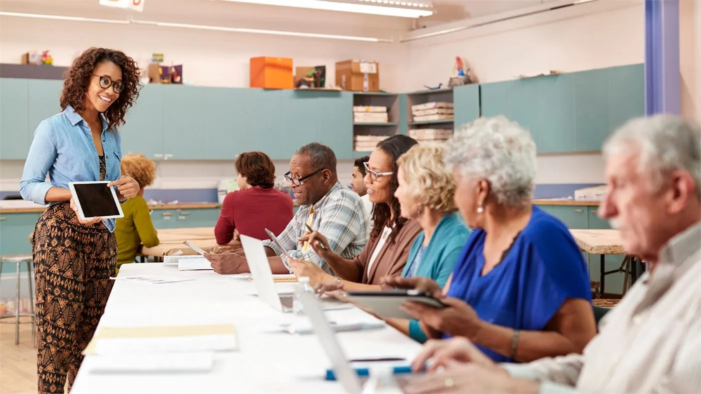 Instructor leading a CHHA training class with adult students